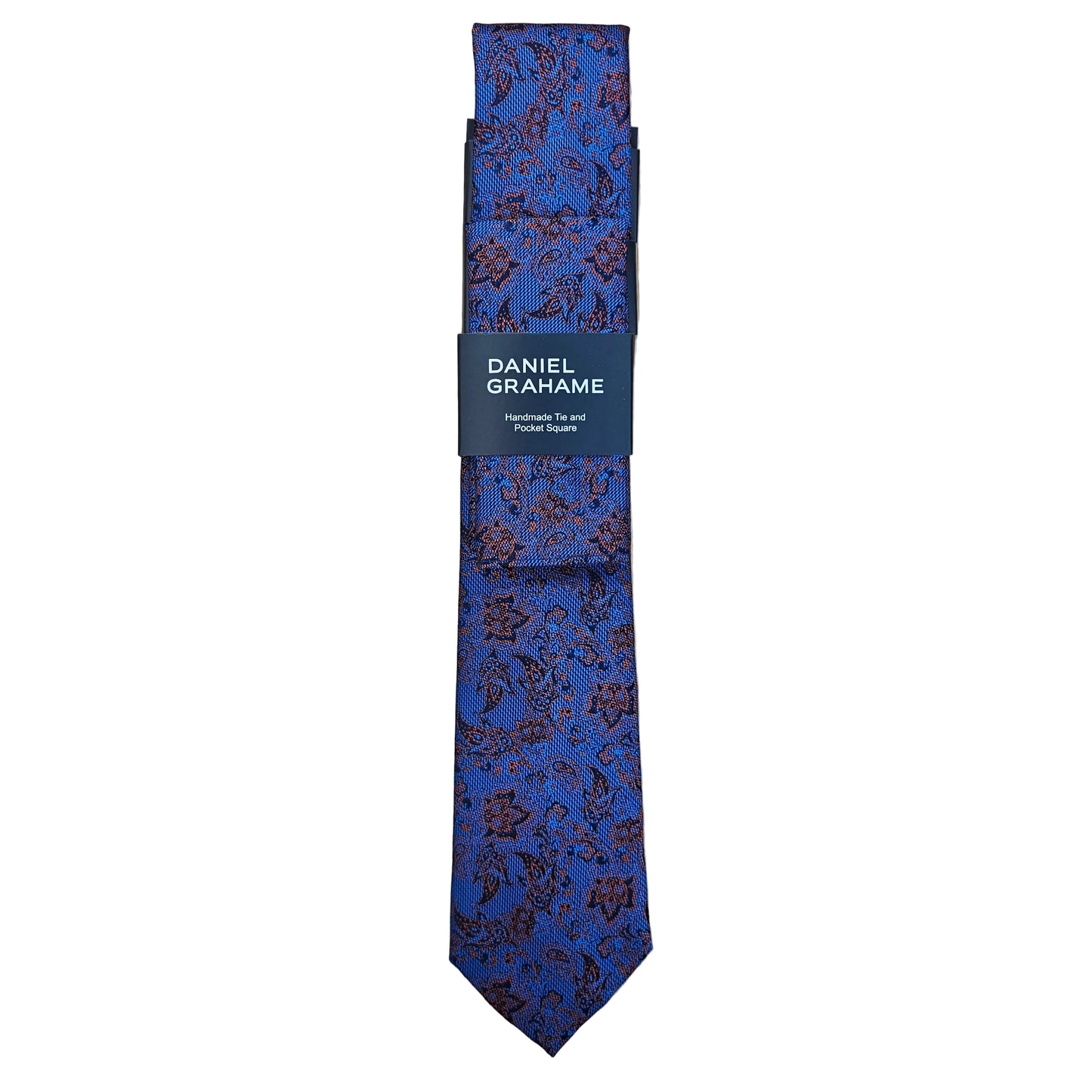 A blue patterned necktie with a dark navy band label that reads 'DANIEL GRAHAME', laid flat on a light wood grain surface.