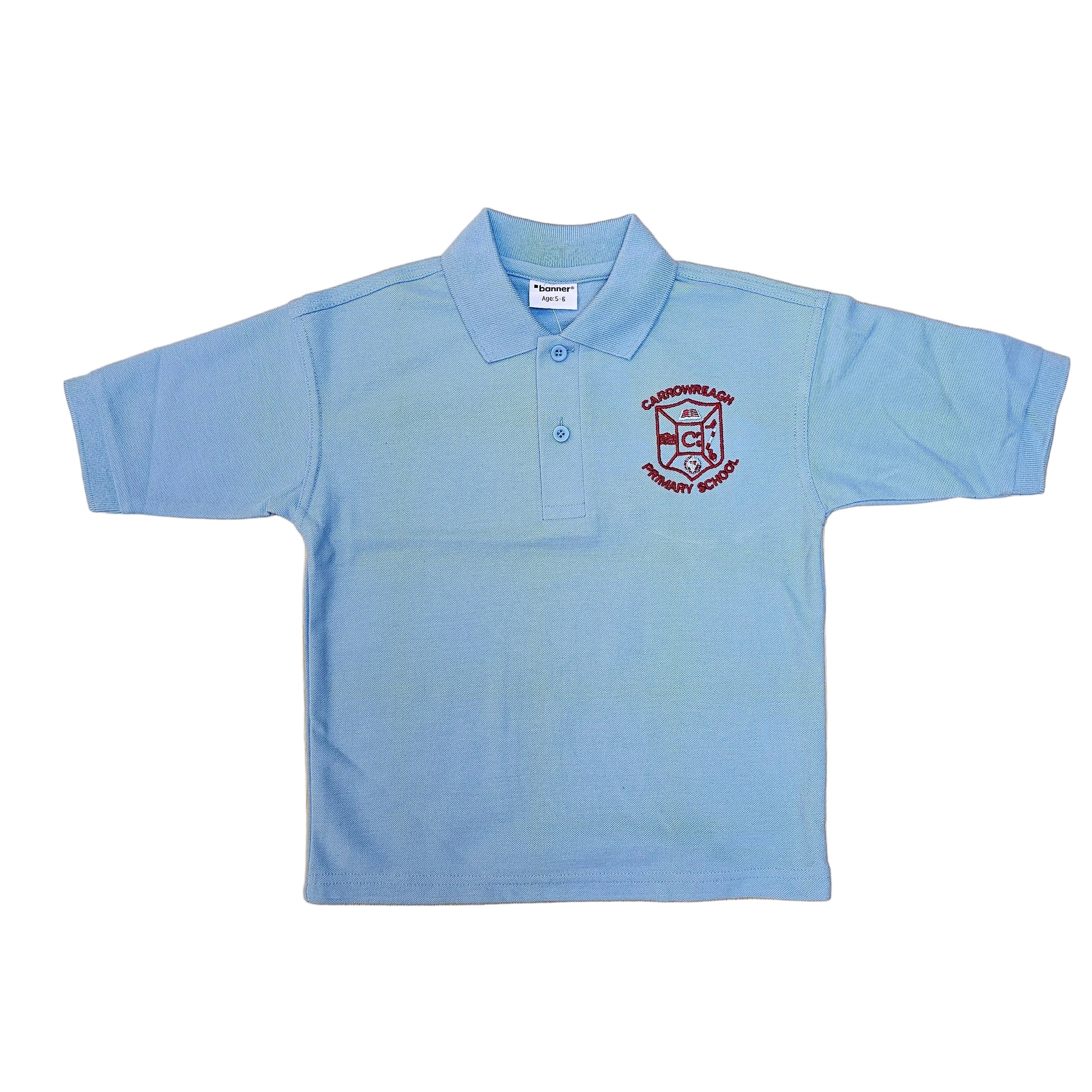 A light blue short-sleeve polo shirt with a red embroidered school crest on the left chest, laid flat on a light wood grain surface.